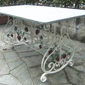 Wrought iron table rectangle scrolls and grape bunches of decorum.