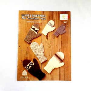 May include: A knitting pattern booklet for mittens featuring White Buffalo The Canadian Yarn. The cover shows five different pairs of mittens in various colors and patterns, including brown, white, and gray.