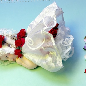 This x-Large  baby is as cute as can be. Can change flower color on first picture.  Baptism, Cake Topper and maybe because she is just cute.