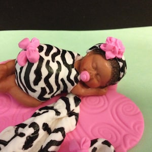 Dressed in her Zebra onesie with her little Blanket near by. Baby Shower, Birthday Baptism, Cake Topper and more