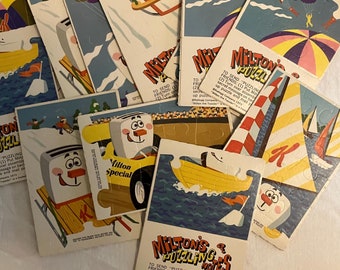 Caja de cereales con premios de Vintage Milton's Puzzling Notes (juego de 12) - Paracaidistas, paseos en bote, trineos, autos de carrera