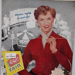 May include: A vintage knitting pattern featuring a woman wearing a red cardigan with a white polka dot scarf. The pattern is for a "Motoravia Double Knitting" cardigan and requires 10 ounces of yarn. The pattern is from Lee Target.