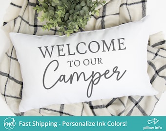 May include: White pillow with the text "Welcome to our Camper" in gray lettering.