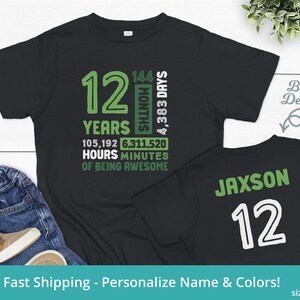 May include: Black t-shirt with green text that says "12 Years 144 Months 4,383 Days 105,192 Hours 6,311,520 Minutes of Being Awesome". The back of the shirt has green text that says "Jaxson 12".