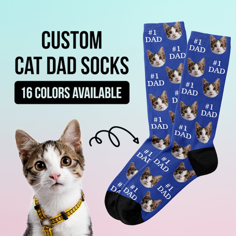May include: A pair of blue socks with a cat's face printed on them. The socks say "#1 Dad" on them. The socks are shown with a cat wearing a yellow collar.