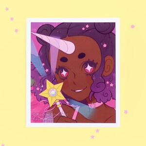 A small illustration print of an anime-style unicorn girl holding a magical rainbow star wand.