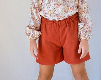 Rust corduroy shorts girl