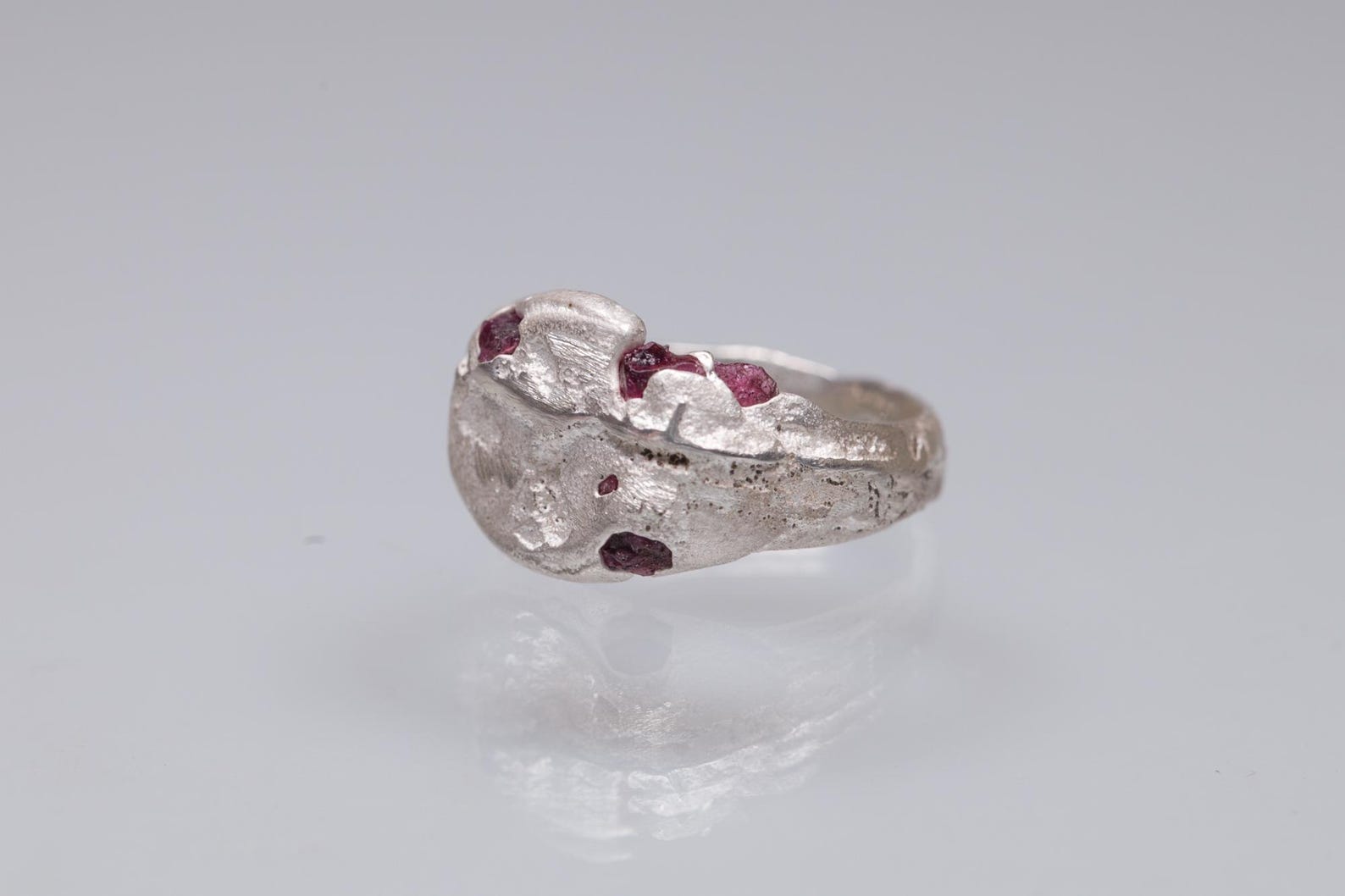 Sterling Silver Ring Cast in Beach Sand With Rough Rubies Set on It ...