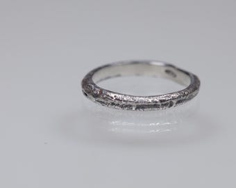 Oxidized sterling silver sandcast ring cast in beach sand, tiny textured sand ring