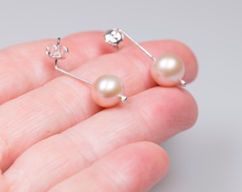 Minimalist dangling pink pearl earrings unisex
