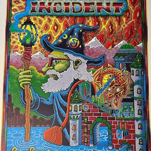 May include: A colourful poster for the String Cheese Incident music festival. The poster features a wizard with a long beard and a pointed hat, holding a staff. The wizard is standing in front of a city with a castle and a dragon. The text "The String Cheese Incident" is written in large letters at the top of the poster. The text "Sol Shine A Music and Arts Reverie May 24-26, 2024 Three Sisters Park Chillicothe IL" is written at the bottom of the poster.