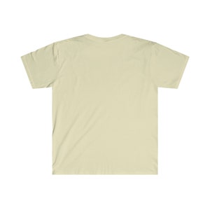 May include: A plain, light beige t-shirt with short sleeves.