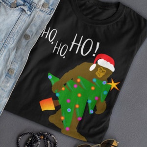 Big Foot Christmas Shirt, Big Foot Gifts, Funny Holiday Tshirt, Big Foot Santa Squatching Through The Snow Shirt Christmas Tree Believe