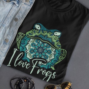 May include: Black t-shirt with a green and blue mandala frog design and the text "I love Frogs".