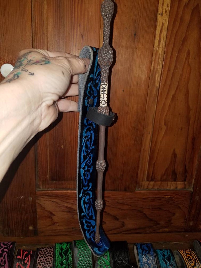 All leather tooled wand holders. Fits all sizes. Belt loop. Heav All leather tooled wand holders. Fits all sizes. Belt loop. Heav