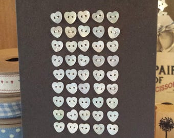 Set of mother of pearl heart shape buttons