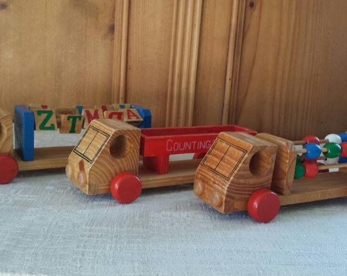 Set of 3 wooden trucks for counting and spelling
