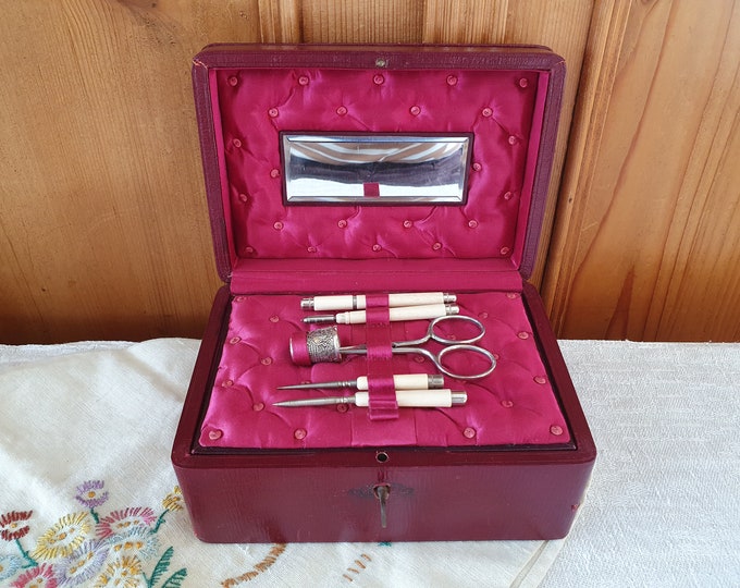 Antique sewing box with antique bone sewing tools, red leather, English