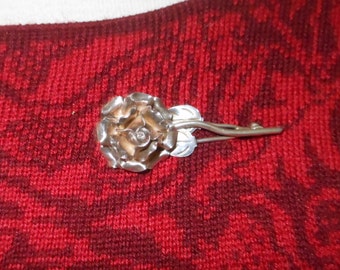 Silver rose brooch