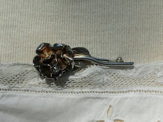 Silver rose brooch