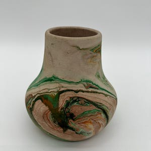 Vintage Nemadji pottery vase in greens and oranges