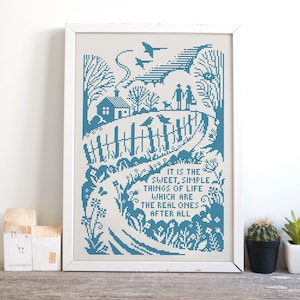 May include: Blue cross-stitch embroidery with a white background. The design features a house, a couple walking a dog, birds flying, and a fence. The text reads "It is the sweet, simple things of life which are the real ones after all."