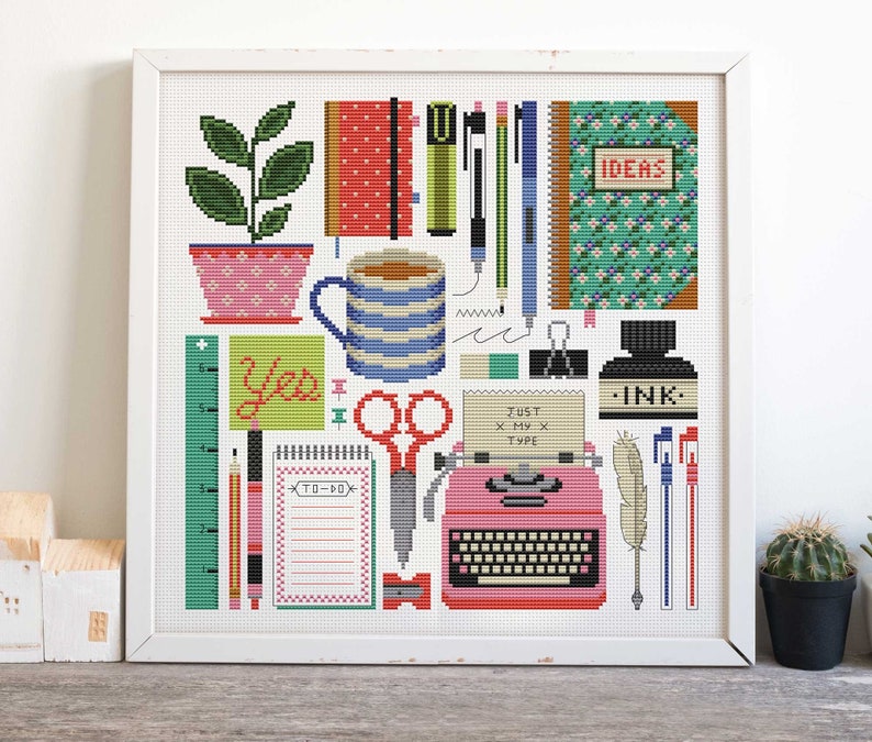 May include: A cross-stitch pattern featuring a collection of office supplies, including a typewriter, scissors, a potted plant, a coffee mug, pencils, pens, a ruler, a notepad, and a notebook. The pattern includes the text "Yes", "To-Do", "Just x My x Type", "Ideas", and "Ink."