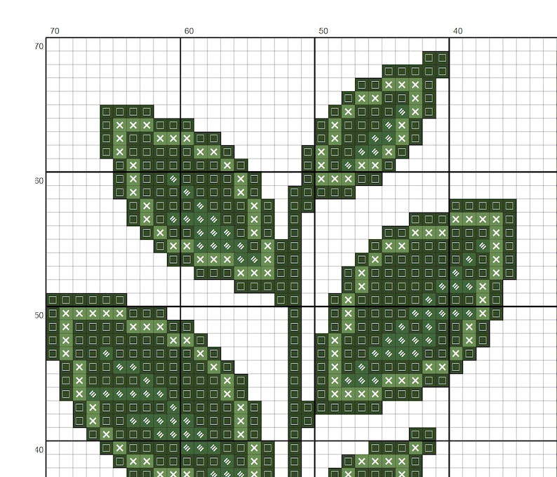 May include: Green leaf design cross stitch pattern with white X's on a white background.