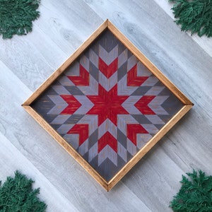 Rustic Wood Wall Art. Wooden Star Barn Quilt. Bursting Star Quilt Block Pattern in Gray and Red Colors. Colorful and Decorative Wall Decor