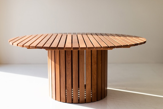 Round outdoor wood dining table great for outdoor living