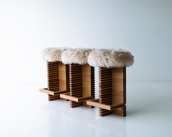 Taburete de mostrador Cicely moderno con asiento de piel de oveja