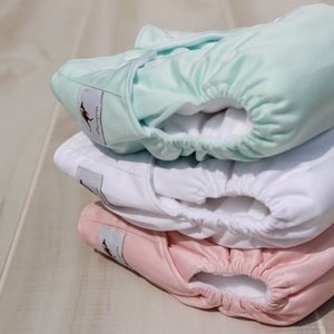 Momgaroo, paquete de 6 pañales de bolsillo de talla única, se adapta desde recién nacido hasta los 3 años.