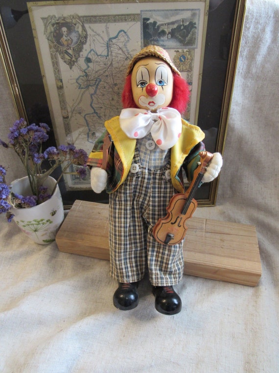 sad clown porcelain doll