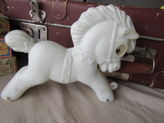 white plastic horse