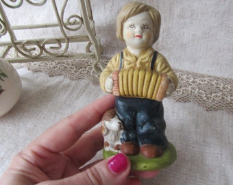 vintage statue boy with accordion, boy with dog, bisque porcelain figurine