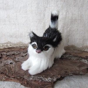 fluffy cat, artificial fluff animal figurine, black and white tabby cat