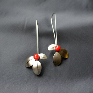 Stainless steel leaves earrings with a red drop