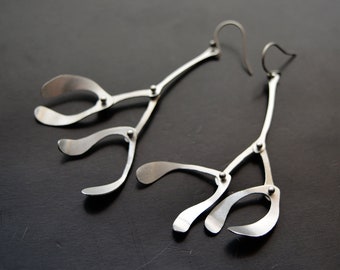Kinetic earrings made of stainless steel mistletoe
