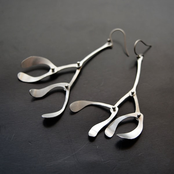 Kinetic earrings made of stainless steel mistletoe