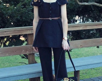 A set of peplum top with long pants and evening purse