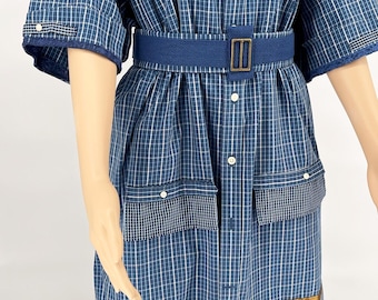 A set of maxi shirt dress with belt, pants, and suede bag