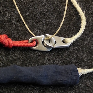 Cover Pipe protects against snagging, clamping, opening.Brummel, hook, mumble, clip, knot, buckle, paraglider, connection, accessories, gift