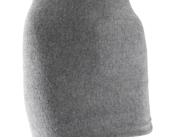 May include: A gray mini skirt made of a soft, fuzzy fabric. The skirt has a simple, straight cut and a slightly flared hem.
