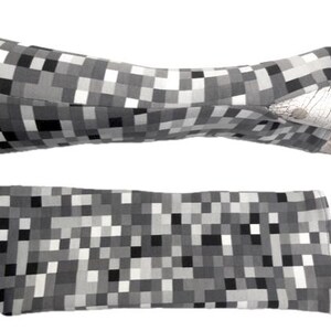 May include: A pair of fingerless gloves and a matching wristband. Both items feature a pixelated pattern in shades of gray, black, and white. The gloves are shown on a mannequin hand, while the wristband lies flat.