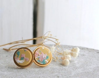EARRING in polymer clay, yellow mustard background color with pale blue, pink and white sprinkle, gold base studs.