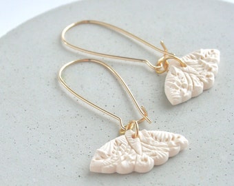 EARRING handmade in polymer clay, ivory color, butterfly shape pendant on a long (gold or silver) hoop.