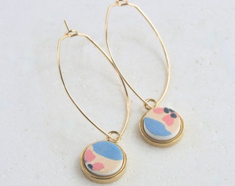 EARRING, long gold plated oval ring and gold plated round pendant with polymer clay piece. Only one pair.