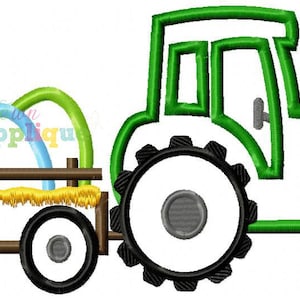 May include: A green tractor with a wagon filled with colourful pumpkins. The wagon has hay bales on the bottom and the tractor has black wheels.
