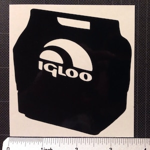 May include: Black and white sticker of an Igloo cooler. The cooler has a handle on top and the Igloo logo is visible on the front.