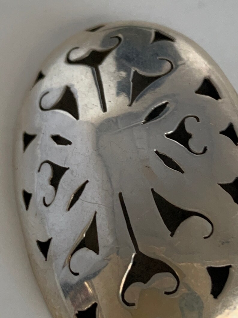 Sterling silver ornate brooch from Mexico.